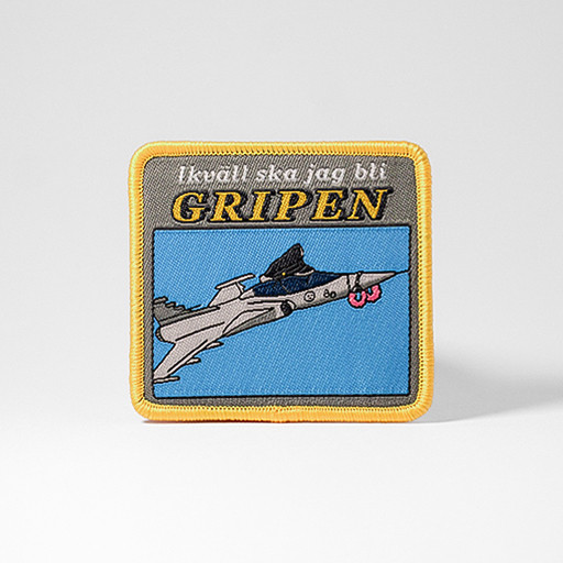 Gult tygmärke med texten "Ikväll Ska Jag Bli Gripen"